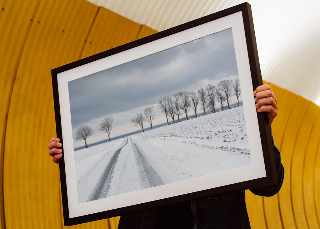 Snowy road towards the sea