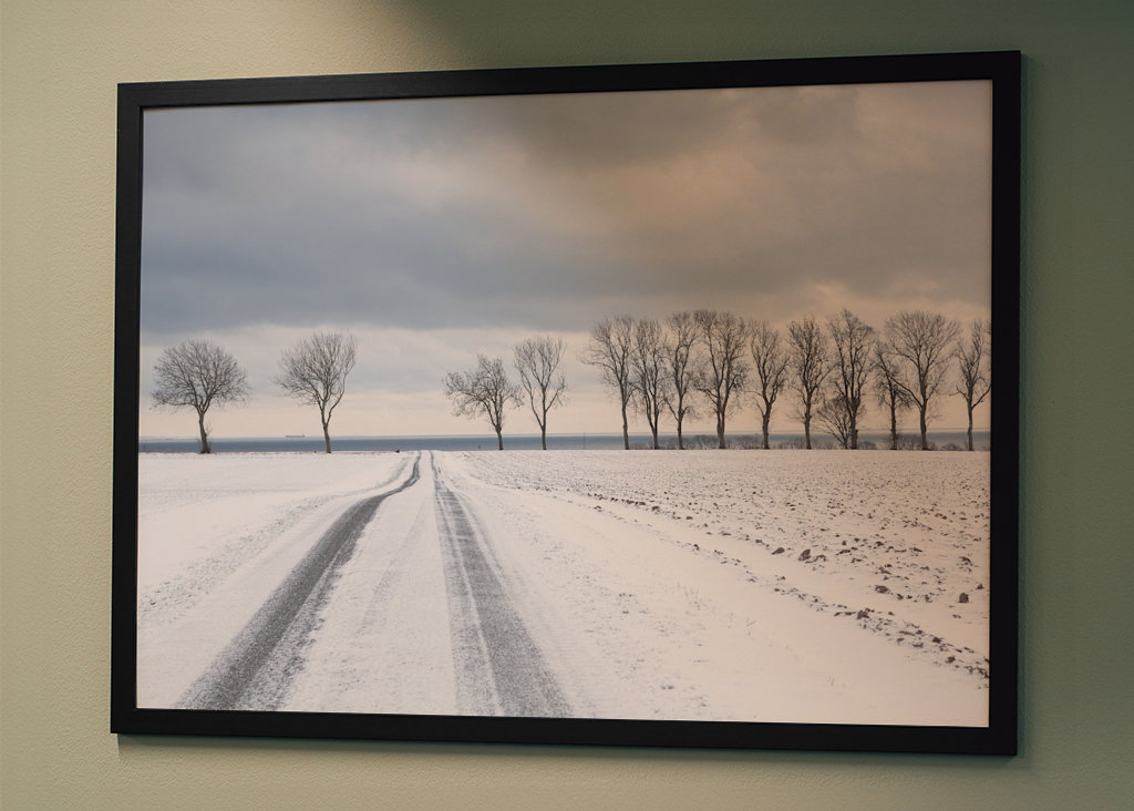 Snowy road towards the sea